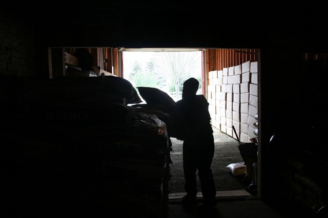A day's work at Lakeside Feed, inside the former dairy barn.