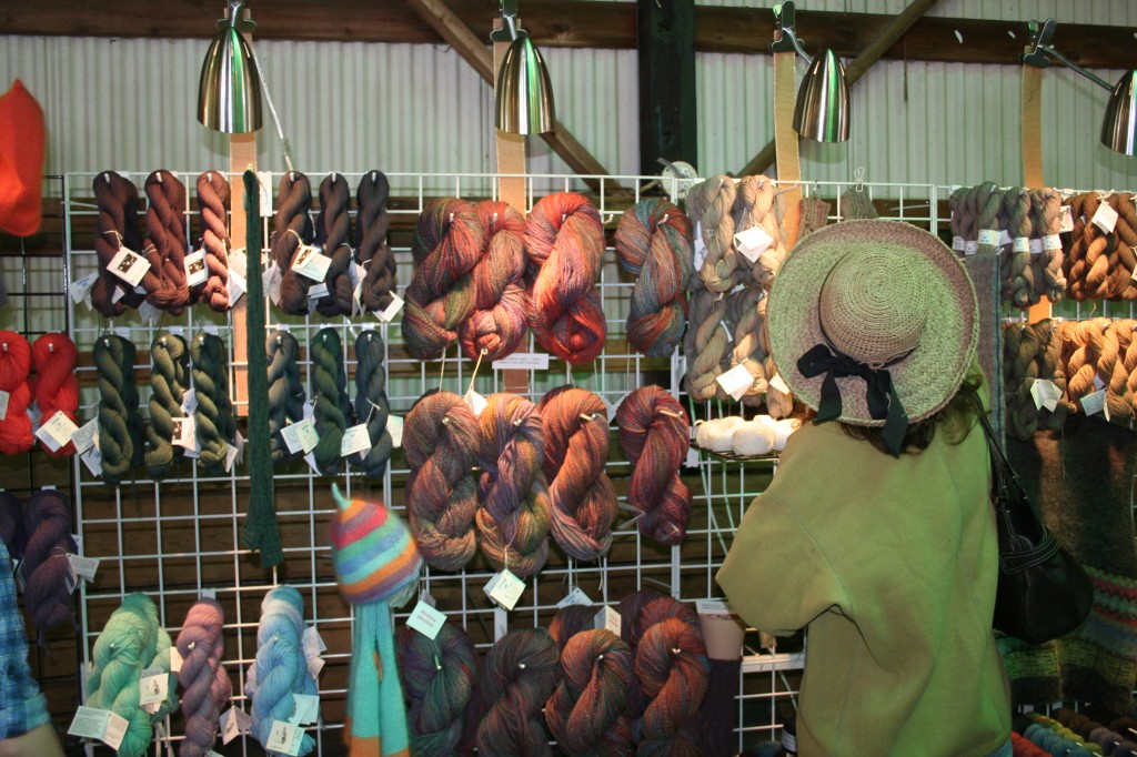 A customer at the Still River Mill booth area at the Connecticut Sheep Wool and Fiber Festival.